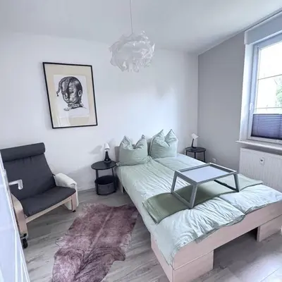 Ein Bett oder Betten in einem Zimmer der Unterkunft Sonnige 2 Raumwohnung in Niederwiesa