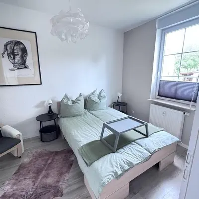 Ein Bett oder Betten in einem Zimmer der Unterkunft Sonnige 2 Raumwohnung in Niederwiesa