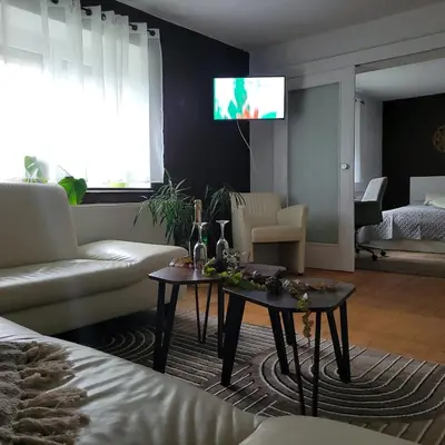 Ein Sitzbereich in der Unterkunft Pension - Ferienwohnung K&M