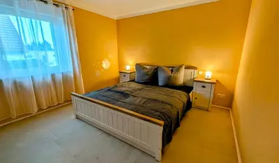 Ein Bett oder Betten in einem Zimmer der Unterkunft Haus am Borsberg