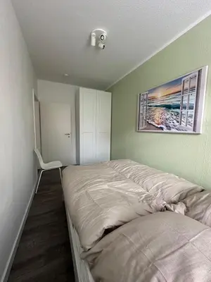 Ein Bett oder Betten in einem Zimmer der Unterkunft Moderne 2-Zimmer Wohnung nahe Zentrum