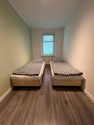 Ein Bett oder Betten in einem Zimmer der Unterkunft Stadtnahe 3-Schlafzimmer-Wohnung