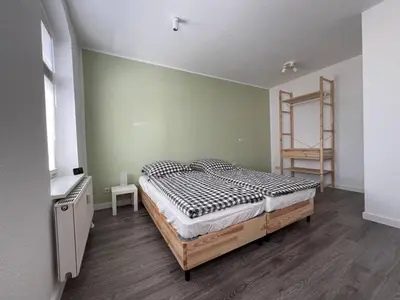Ein Bett oder Betten in einem Zimmer der Unterkunft Stadtnahe 3-Schlafzimmer-Wohnung