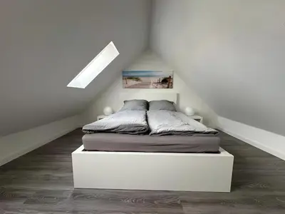 Ein Bett oder Betten in einem Zimmer der Unterkunft Zentrale Maisonette - 4 Personen