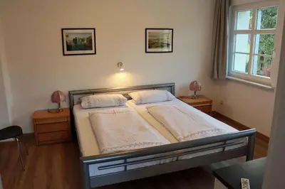 Ein Bett oder Betten in einem Zimmer der Unterkunft Ferienwohnung im Kasperhaus