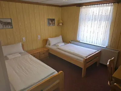 Ein Bett oder Betten in einem Zimmer der Unterkunft Gasthaus Wolfsschlucht