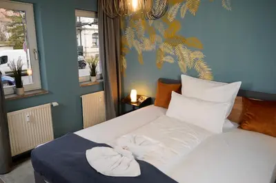 Ein Bett oder Betten in einem Zimmer der Unterkunft Ankommen & wohlfühlen - Ihr stilvolles Zuhause