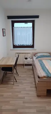Ein Bett oder Betten in einem Zimmer der Unterkunft Pension Hänsel