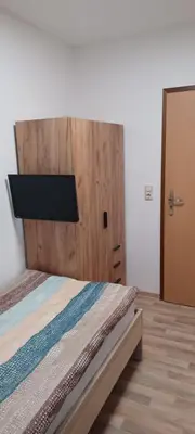 Ein Bett oder Betten in einem Zimmer der Unterkunft Pension Hänsel