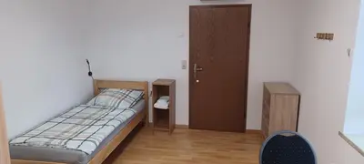 Ein Bett oder Betten in einem Zimmer der Unterkunft Pension Hänsel