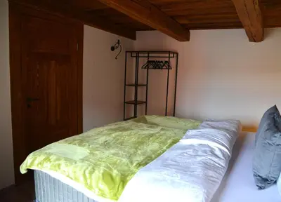 Ein Bett oder Betten in einem Zimmer der Unterkunft Ferienhaus mit 2 Schlafzimmern in Grimma nahe Mulderadweg