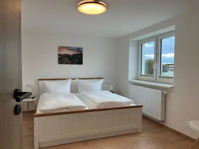Ein Bett oder Betten in einem Zimmer der Unterkunft 4-Steine-Blick, Wohnung 2