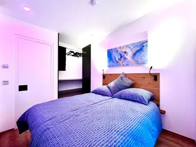 Ein Bett oder Betten in einem Zimmer der Unterkunft Moderne FeWo im Taubenhaus