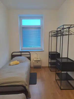 Ein Bett oder Betten in einem Zimmer der Unterkunft Gemütliche 4-Zimmer Wohnung mit 7 Schlafplätzen