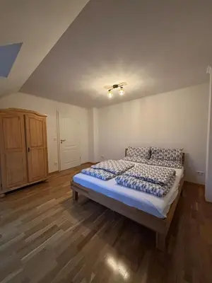Ein Bett oder Betten in einem Zimmer der Unterkunft Moderne 4-Zimmer Wohnung mit Balkon