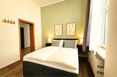 Ein Bett oder Betten in einem Zimmer der Unterkunft LUMA Apartments