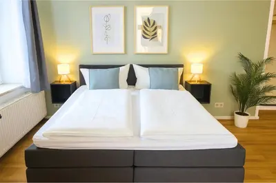 Ein Bett oder Betten in einem Zimmer der Unterkunft LUMA Apartments
