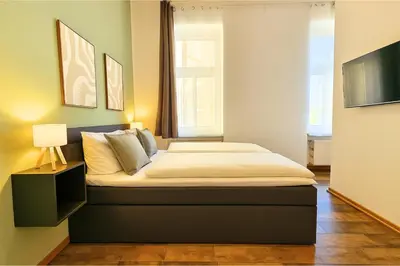 Ein Bett oder Betten in einem Zimmer der Unterkunft LUMA Apartments