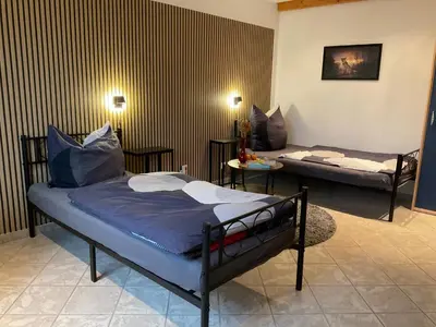 Ein Bett oder Betten in einem Zimmer der Unterkunft Ferienwohnung Mitko