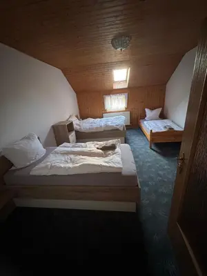 Ein Bett oder Betten in einem Zimmer der Unterkunft Gästehaus Trompeter