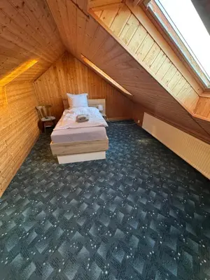 Ein Bett oder Betten in einem Zimmer der Unterkunft Gästehaus Trompeter