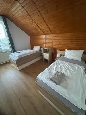Ein Bett oder Betten in einem Zimmer der Unterkunft Gästehaus Trompeter