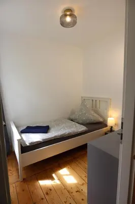 Ein Bett oder Betten in einem Zimmer der Unterkunft Gemütliches Schmuckstück mit zwei Schlafzimmern