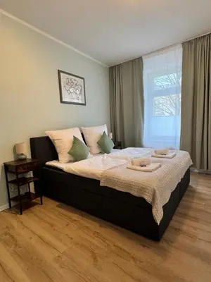 Ein Bett oder Betten in einem Zimmer der Unterkunft Arminos Apartment