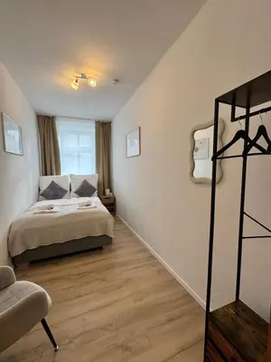 Ein Bett oder Betten in einem Zimmer der Unterkunft Arminos Apartment