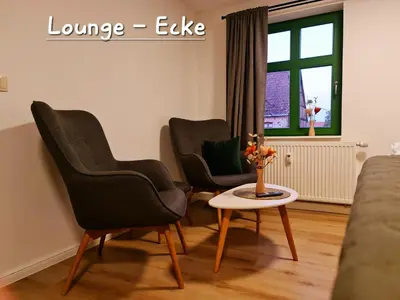Ein Sitzbereich in der Unterkunft Apartment Marktplatz