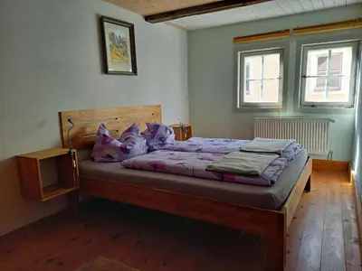 Ein Bett oder Betten in einem Zimmer der Unterkunft Ferienhaus Altes Elbschifferhaus