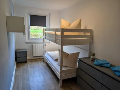 Ein Bett oder Betten in einem Zimmer der Unterkunft Ferienwohnung August 29