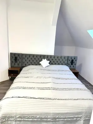Ein Bett oder Betten in einem Zimmer der Unterkunft Aparthotel