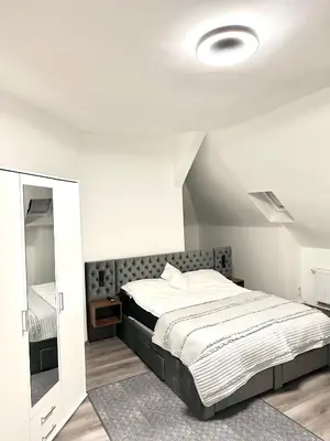 Ein Bett oder Betten in einem Zimmer der Unterkunft Aparthotel
