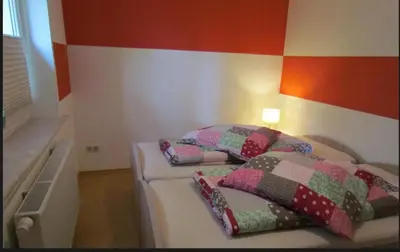 Ein Bett oder Betten in einem Zimmer der Unterkunft Ferienwohnung am Wolfsberg