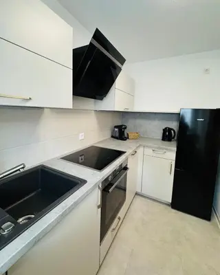 Küche/Küchenzeile in der Unterkunft Modernes 2-Zi Apartment mit Terrasse und Garten