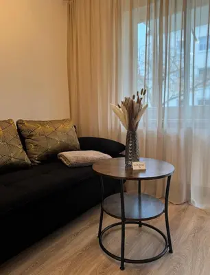 Ein Sitzbereich in der Unterkunft Modernes 2-Zi Apartment mit Terrasse und Garten
