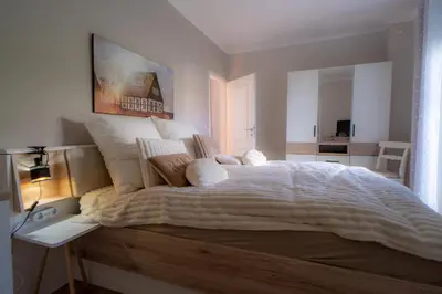 Ein Bett oder Betten in einem Zimmer der Unterkunft SILBERhERZ