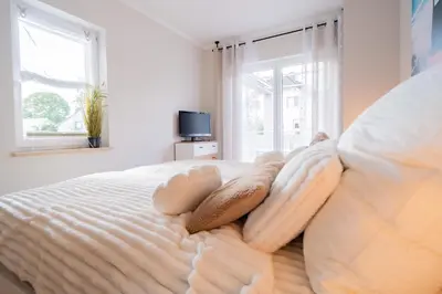 Ein Bett oder Betten in einem Zimmer der Unterkunft SILBERhERZ