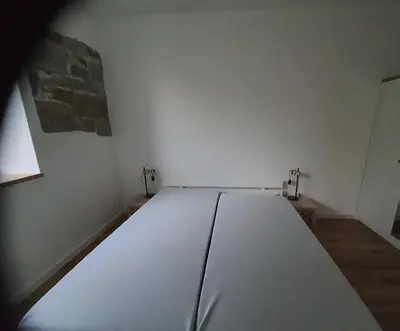 Ein Bett oder Betten in einem Zimmer der Unterkunft Fewo EG