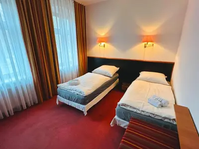 Ein Bett oder Betten in einem Zimmer der Unterkunft Hotel an der Rennbahn Kostenloses Parken