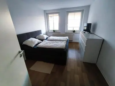 Ein Bett oder Betten in einem Zimmer der Unterkunft Business Apartment Chemnitz