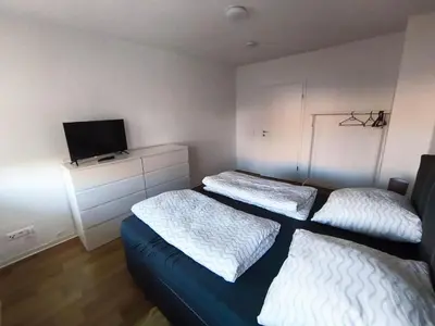 Ein Bett oder Betten in einem Zimmer der Unterkunft Business Apartment Chemnitz