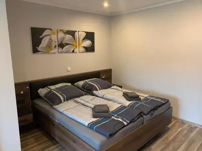 Ein Bett oder Betten in einem Zimmer der Unterkunft FeWo Familie Herold - 2 SZ