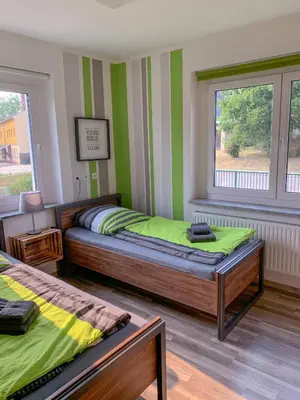 Ein Bett oder Betten in einem Zimmer der Unterkunft FeWo Familie Herold - 2 SZ