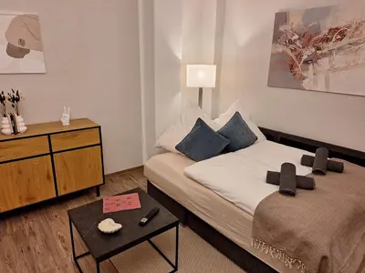 Ein Bett oder Betten in einem Zimmer der Unterkunft Ehrwürdig wohnen am hinteren Kassberg