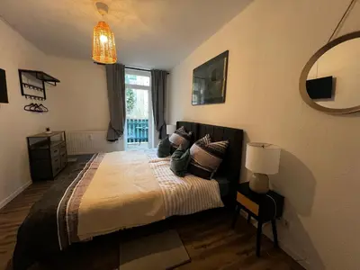 Ein Bett oder Betten in einem Zimmer der Unterkunft Wohnen im Musikerviertel-Apartment Sun -