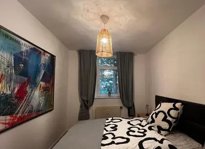 Ein Bett oder Betten in einem Zimmer der Unterkunft Wohnen im Musikerviertel-Apartment Sun -