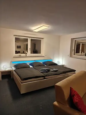Ein Bett oder Betten in einem Zimmer der Unterkunft Family Room Grüne Auszeit Dresden