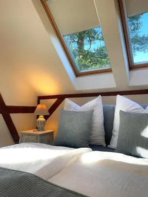 Ein Bett oder Betten in einem Zimmer der Unterkunft Luxus-Ferienwohnung in der Sternkopf-Engel-Villa